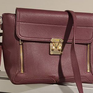Danier leather crossbody plum and gold nwot